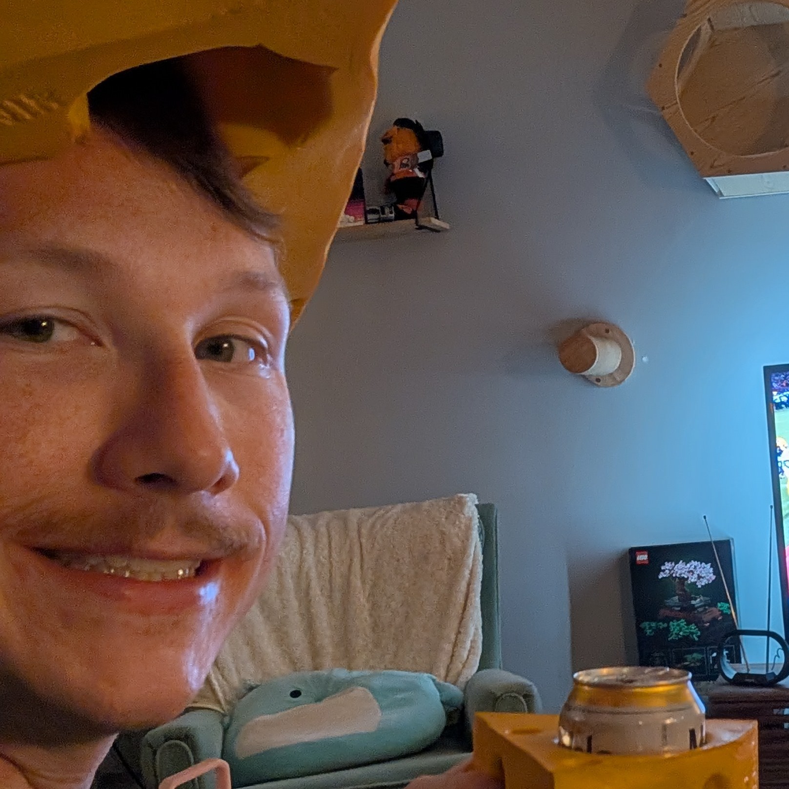 A picture of Colin with a cheesehead on, preparing to watch his beloved Packers lose once again in the playoffs